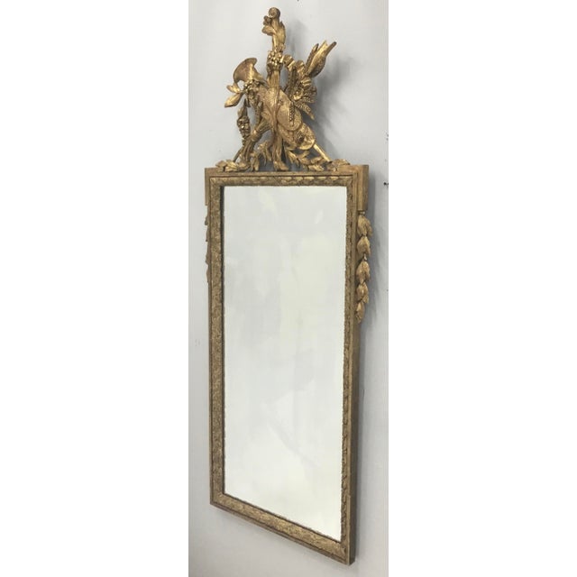 Magnificent tall period Louis XVI carved wood and parcel gilt mirror . Exquisitely detailed carved crest , carved floral...