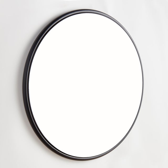 This sleek round iron stock frame in black is an inspired look. With a beveled edge, this stylish mirror creates a bold...