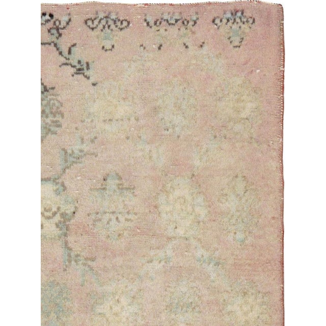 A vintage Turkish Anatolian throw rug. This rustic Anatolian small scatter has an almost totally subdued field with only a...