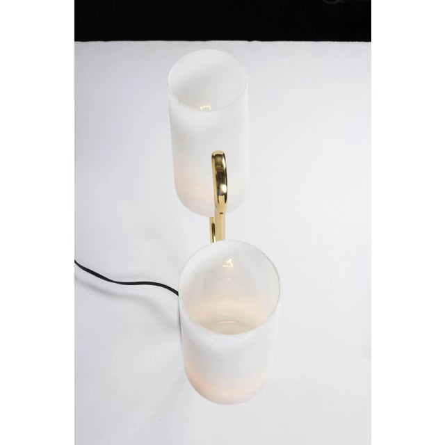 Italian 1950s table lamp in brass and case glass satin shades by Stilnovo. Candelabra sockets, brass polished and lacquered.