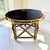 Neo-Classical style "Quince" accent or foyer table designed by Maitland-Smith. Key Features • Design: Features an ebonized...