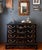 This beautifully preserved black chinoiserie chest of drawers by Habersham features hand-painted landscape motifs that...