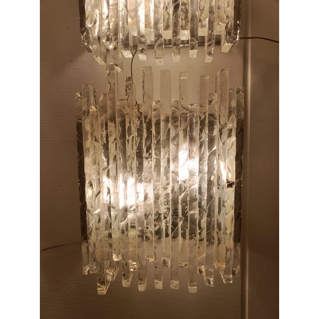 The “Vesta” wall lamp, designed by Albano Poli and produced by the renowned Veronese manufacturer Poliarte. These wall...