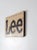 Tan Vintage Lee Logo Ad Sign For Sale - Image 8 of 9