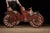 Antique, hand-painted early automobile sign. This piece depicts a turn-of-the-century motor carriage in the style of...