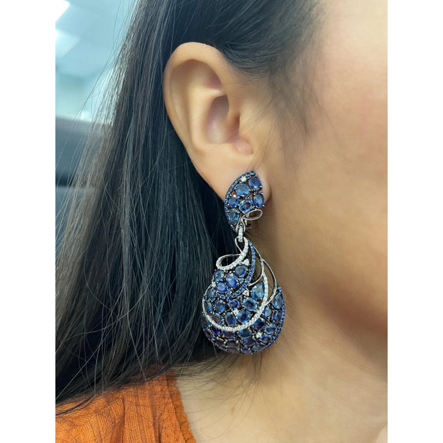 Check out these stunning natural sapphire earrings. The earrings feature 72 natural sapphires weighing 38.03 ct. and 118...