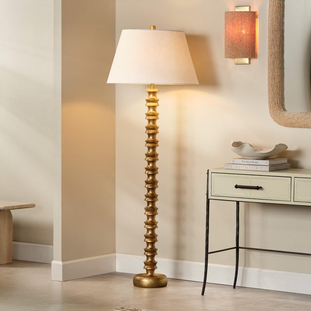 Melrose Floor Lamp, Gold Leaf This table lamp exudes approachable opulence with a cast metal base layered in hand-applied...