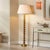 Melrose Floor Lamp, Gold Leaf This table lamp exudes approachable opulence with a cast metal base layered in hand-applied...