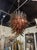 Murano Palm Leaf Chandelier in Tobacco Brown. A Murano palm‑leaf chandelier in tobacco brown is one of the most seductive...
