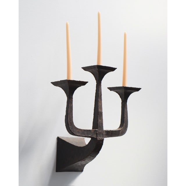 Pair of Brutalist candelabra candle sconces, dated by the owner to approximately the 1960s–1970s. Each sculptural metal...