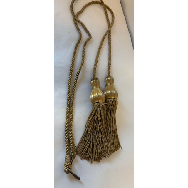 Nice pair of Belgium Tassel tie backs in gold! Wooden cores