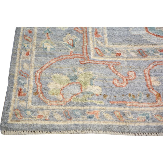 Hand-knotted with care using traditional rug making techniques, this wool rug blends timeless craftsmanship with a modern...
