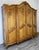 This impressive Vintage French Louis style wardrobe displays rich carved detailing, a sweeping shaped cornice with ornate...