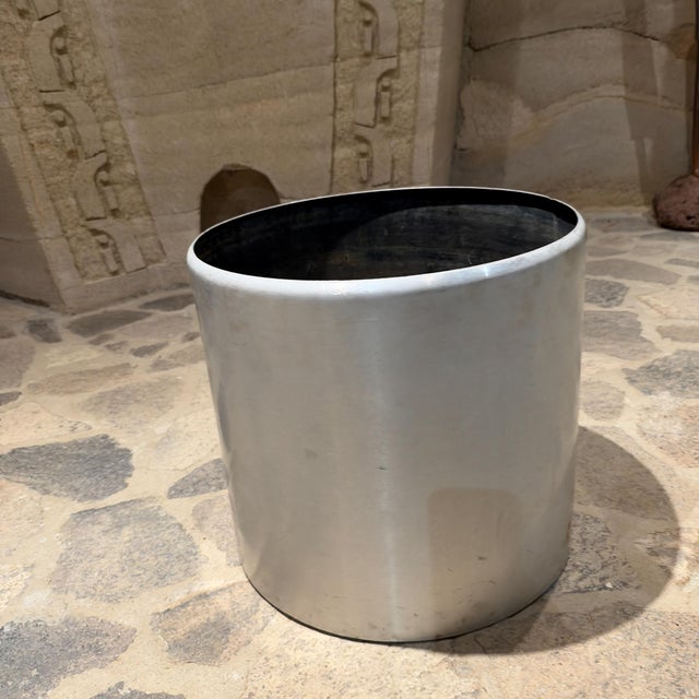 For your consideration, a vintage minimalist aluminum cylinder floor planter, which is highly consistent with 1970s...