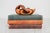Vintage hand-carved wood duck figurine in a preening posture. It is crafted using laminated or inlaid segments of...