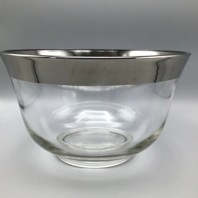 What a great Dorothy Thorpe punch bowl with a large silver band around the rim. This punch bowl comes with a plastic ladle...
