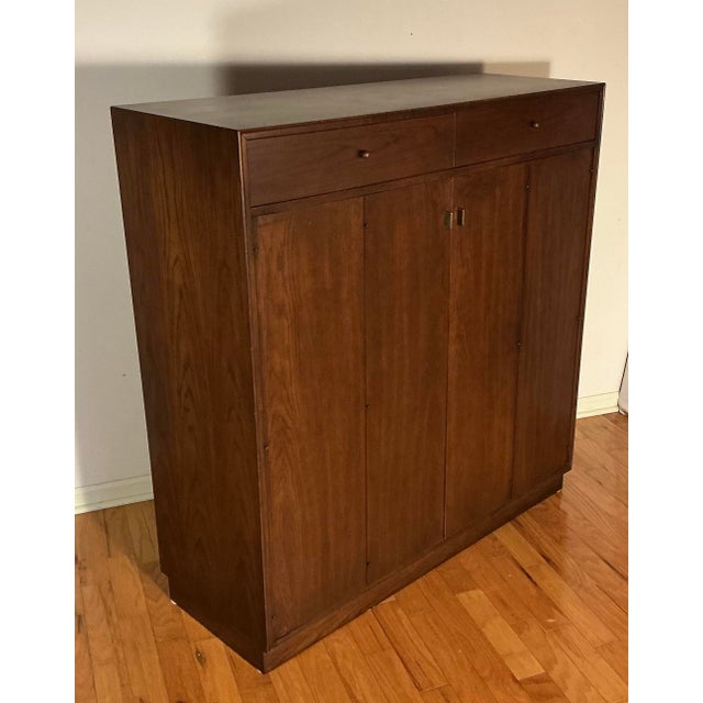 Vintage Mid Century Modern bedroom furniture by Founders Furniture Company, circa 1960s. This set includes, tall Armoire...
