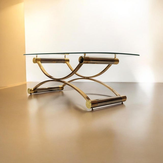 A Stunning Italian vintage MCM coffee table blends M-C structural innovation with Hollywood Regency glamour. Elevate your...