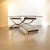 A Stunning Italian vintage MCM coffee table blends M-C structural innovation with Hollywood Regency glamour. Elevate your...