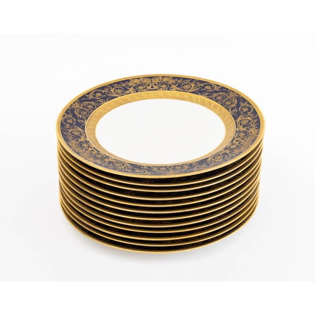Set of 12 C. Ahrenfeldt Limoges for B. Altman Porcelain Dinner Plates, with blue painted and gilt scrollwork, marked to...