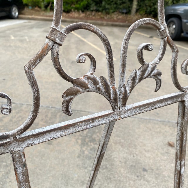 Beautiful large scrolling metal easel. Perfect to hold any oversized painting and to add character to any space.