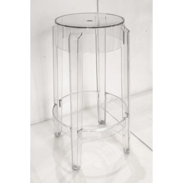 Early 21st century set of 4 Charles Ghost patio bar stools by Philippe Starck for Kartell. Light scratching commensurate...