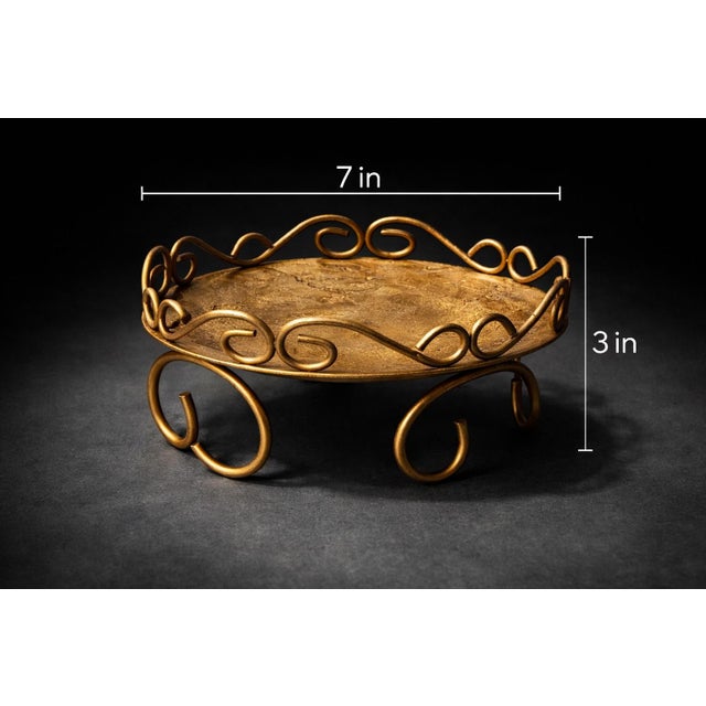A charming vintage Hollywood Regency style gold metal scroll tray, perfect as a candle stand, decorative riser, or elegant...