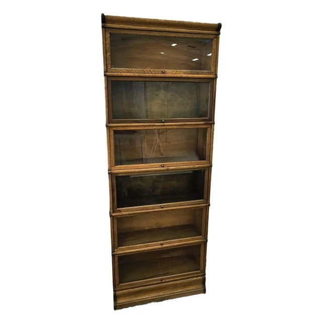 Very tall 6 stack lawyer / barrister bookcase. Beautiful tiger (quarter sawn) oak. It has the nice metal side straps....