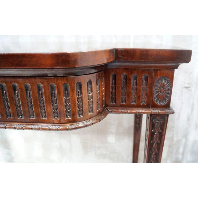 A Superb Victorian Mahogany serving table in the manner of Robert Adams, with a serpentine top above a patera moulded and...