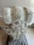 The urn has a wonderful naturally aged and weathered patina, with soft cream, gray tones that give it the appearance of an...
