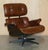 Artsome, hand dyed saddle brown leather lounge armchair with matching ottoman. The ottoman is large and offers plenty of...