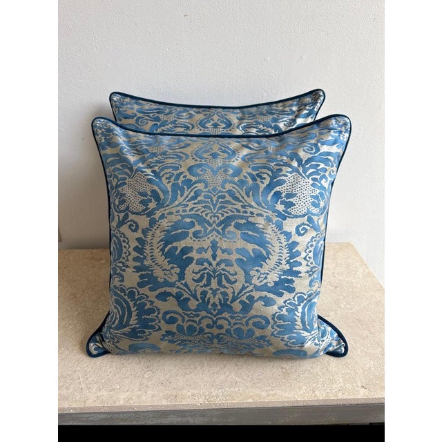 These elegant pillows are crafted from luxurious Italian Fortuny fabric, showcasing a rich damask motif in various shades...
