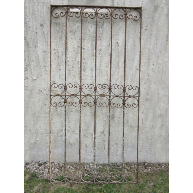 This antique Victorian iron gate is a wonderful piece of architecture. Heavy, tight, and sturdy. Piece does show signs of...