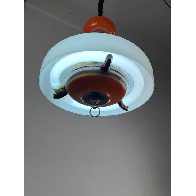 Extendable chandelier in ceramic and glass, Italy, 70s. Neon lamp, it is intact and functioning. Up to 250V (Europe/UK...