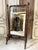 A beechwood cheval mirror in the faux-bamboo style, circa 1900. The lower section features openwork woodwork, and the...