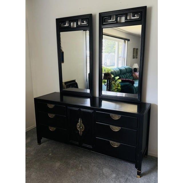Elevate your space with these iconic Mid-Century Chinoiserie statement pieces. Designed by Raymond Sobota for Century...