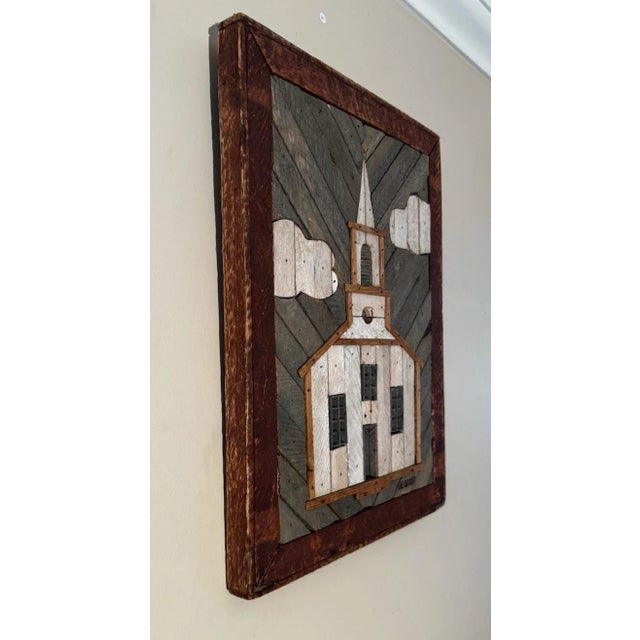 This lathe-art panel is made in herringbone-pattern background with applied low-relief of a white clapboard church with...