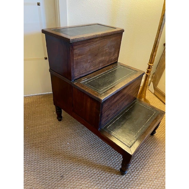 Antique library steps, inlaid with embossed, black leather. Top and middle steps lift up for ample storage, cream damask...