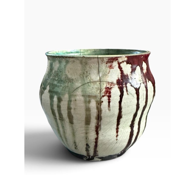 Striking vintage studio pottery bowl featuring an expressive turquoise, olive green, cream, and deep brown drip glaze. The...
