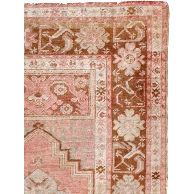 This mid-20th century Turkish Oushak rug, measuring 3' 5" x 5' 6", displays the region’s signature soft palette and...