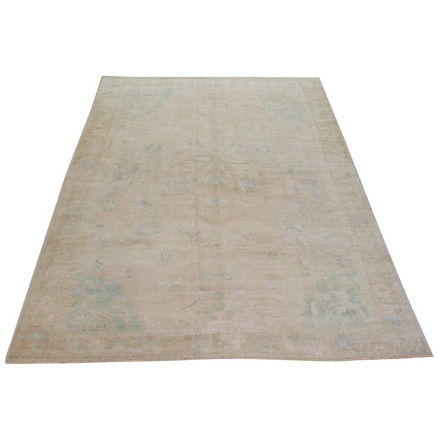 Hand-knotted with care using traditional rug making techniques, this wool rug blends timeless craftsmanship with a modern...