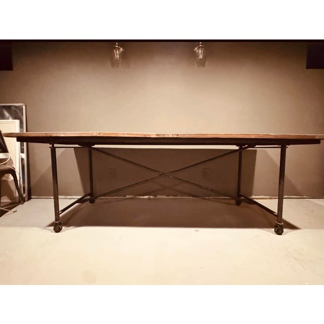 Timeless solid wood and iron table from Restoration Hardware’s retired French industrial collection. Wood is salvaged from...