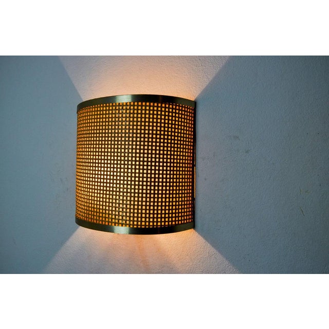 Very beautiful and rare rattan and brass wall lamp designed and produced in Italy in the 1960s. A design classic that will...