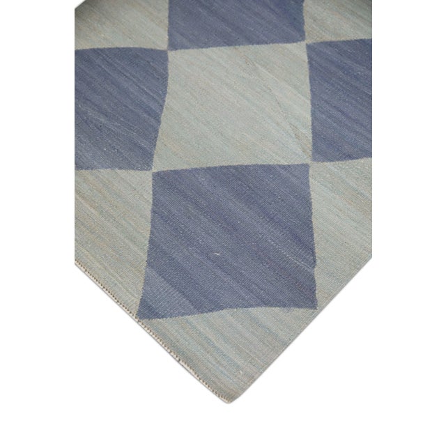 This exquisite Turkish flatweave kilim rug is a stunning masterpiece of traditional craftsmanship. Each rug is...