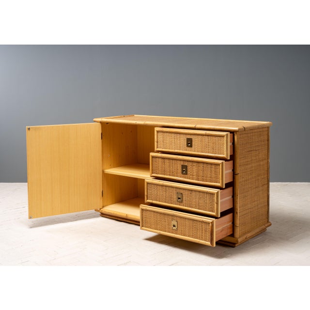 Italy, ca. 1970s. A stylish cane and bamboo chest or sideboard by Italian designer Flam Sansoni for manufacturer Dal Vera....