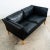High quality early black leather Danish modern 2 seater sofa / couch .This piece was imported directly from Denmark in our...