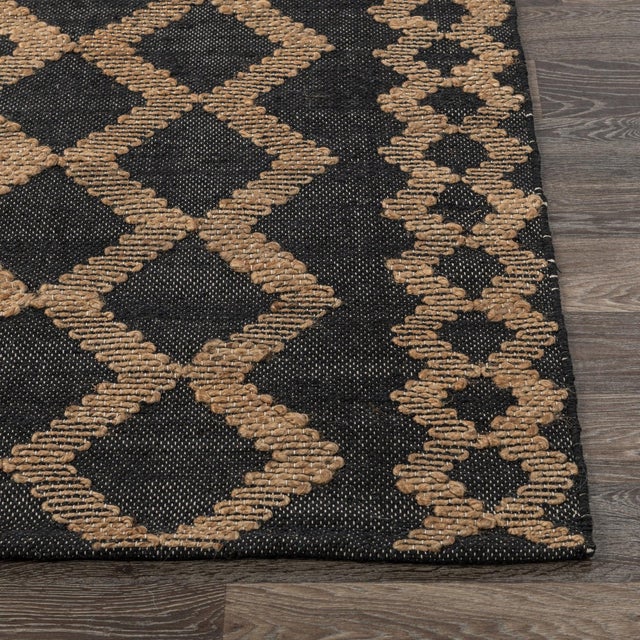 Black cotton rug with natural jute tribal pattern woven in a unique serpentine style. Please note that its appearance may...