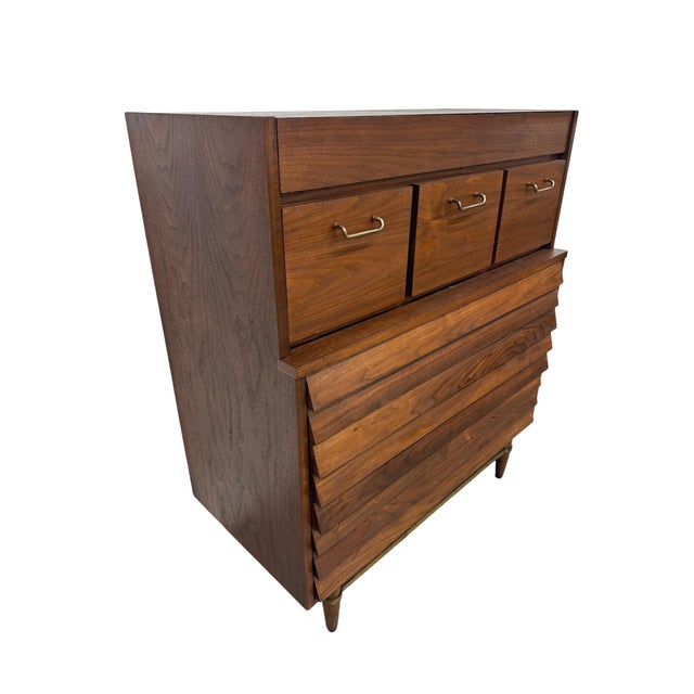Stunning Mid-Century Modern American of Martinsville “Dania” walnut high chest featuring rich walnut grain, clean...