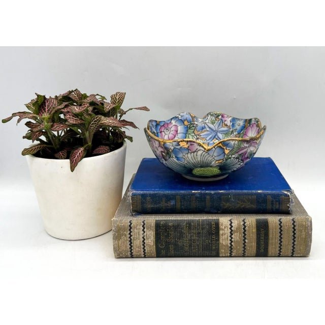 Beautiful, Chinoiserie style ceramic catchall bowl. Pink and blue floral pattern embellished with gold outline. Perfect...