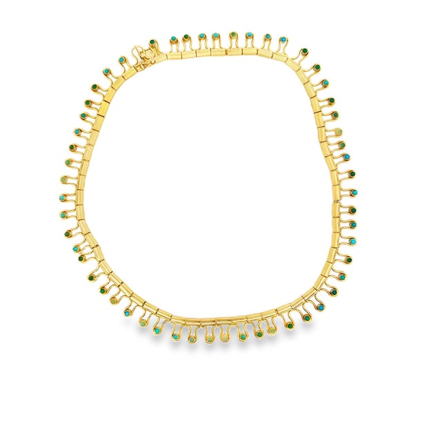 An exceptional vintage Italian collar necklace crafted in 18K yellow gold and set with 55 round turquoise cabochons...